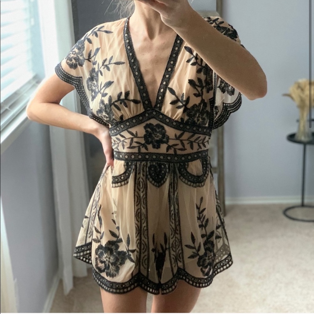 Nude and black romper